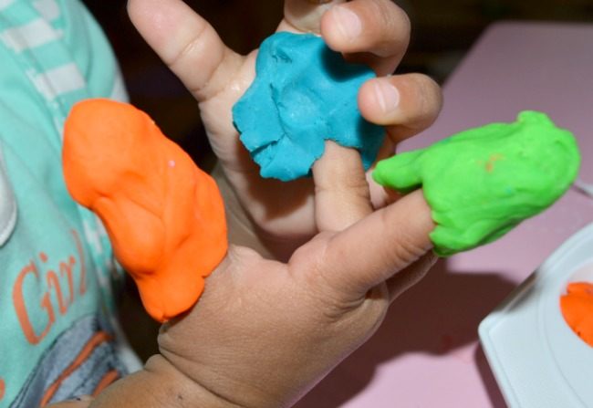 putting on play dough fingers