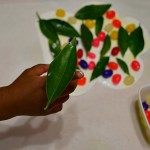 fine motor spring craft holding leaves