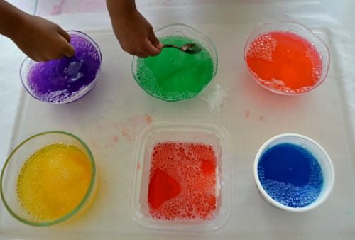 adding baking soda to colored soap water