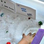 looking for items in the snow sensory bin