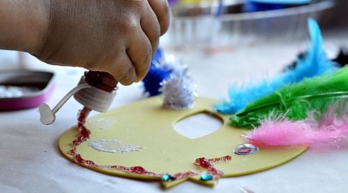 applying glitter glue spring craft for kids