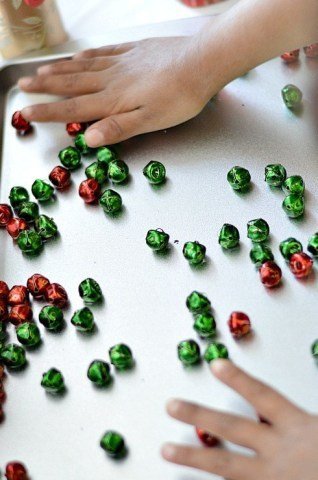 play with jingle bells fine motor play