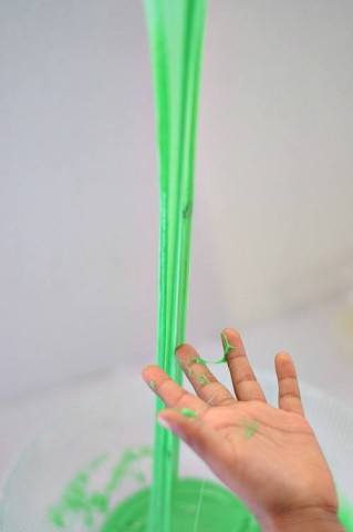 playing with green slime - sensory play